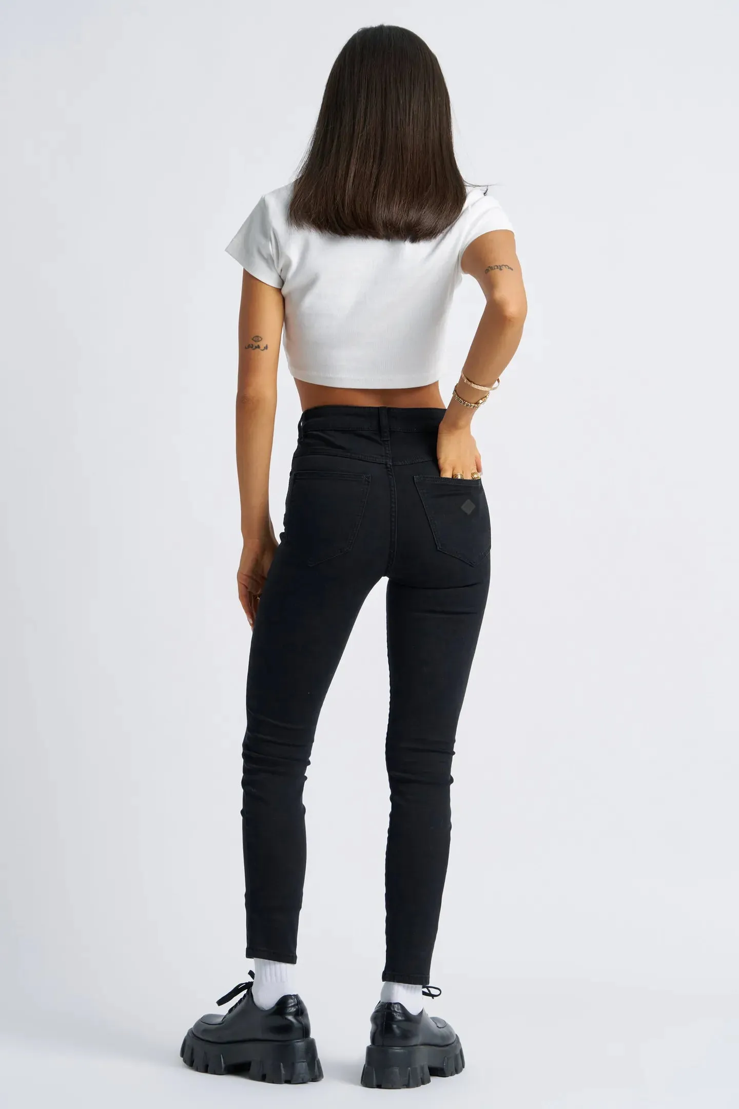 A High Skinny Ankle Basher Petite Jean Black Magic Circular Knit Construction